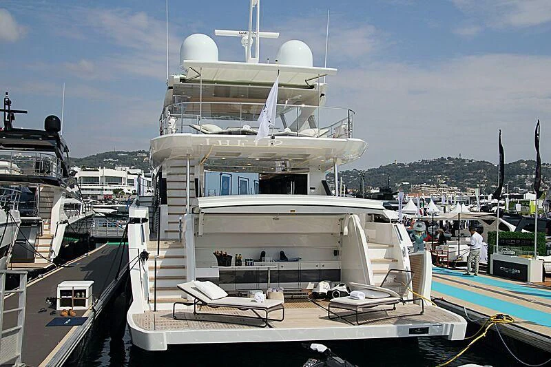 a large white ship docked aboard THETIS Yacht for Sale