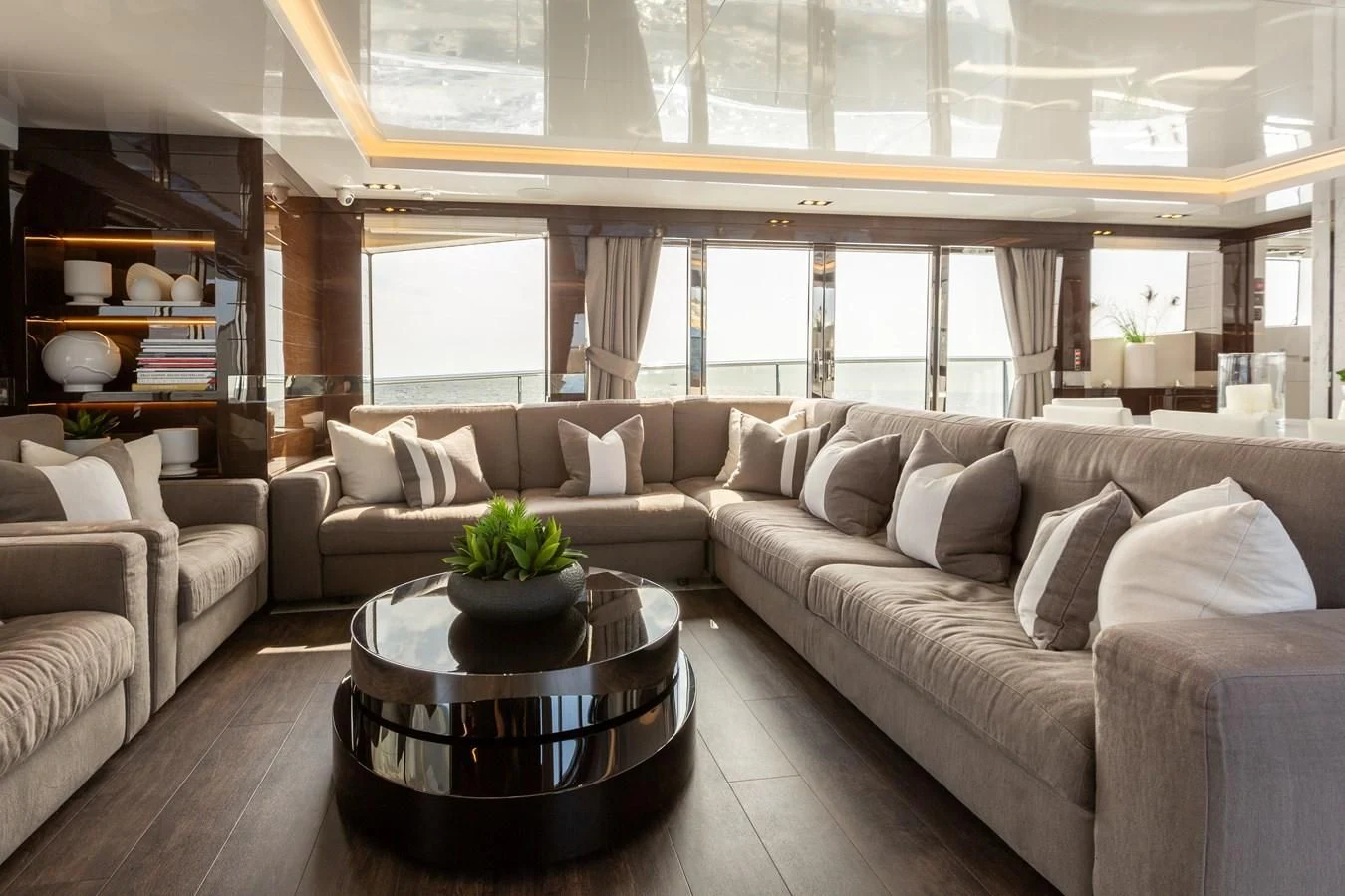 a living room with a large window aboard THETIS Yacht for Sale