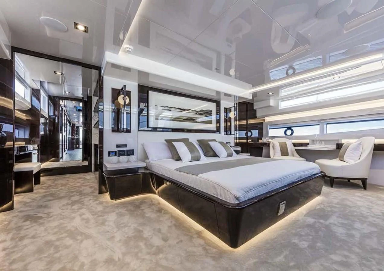 a room with a bed and a couch aboard THETIS Yacht for Sale