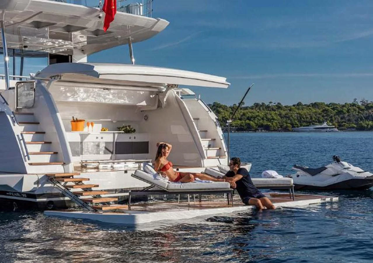 a couple of people on a boat aboard THETIS Yacht for Sale