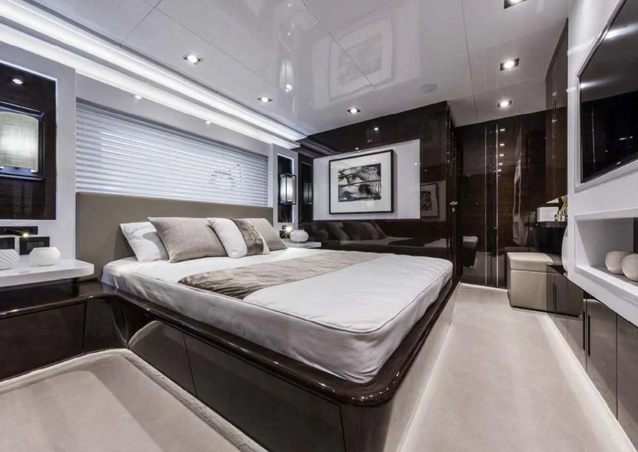 a room with a bed and a tv aboard THETIS Yacht for Sale