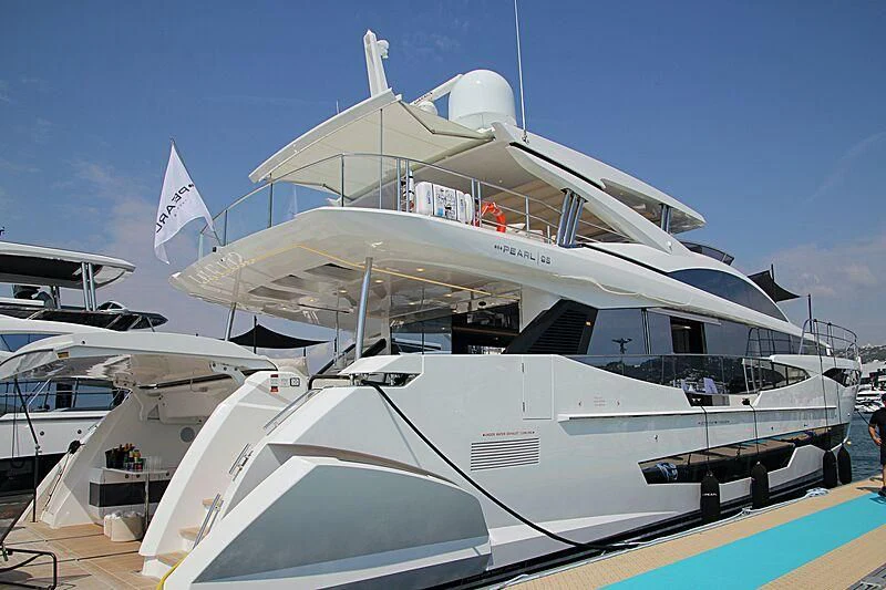 a boat docked at a pier aboard THETIS Yacht for Sale