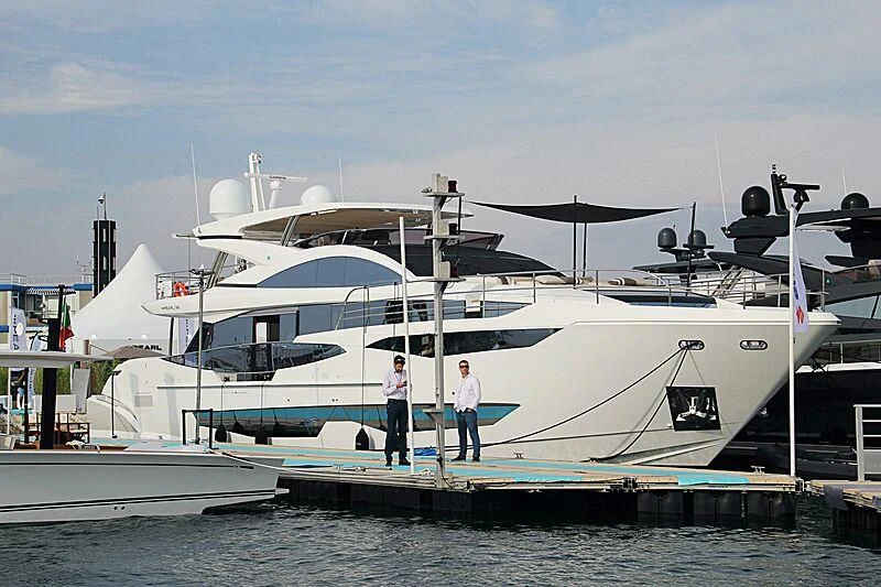 a couple of men standing on a boat aboard THETIS Yacht for Sale
