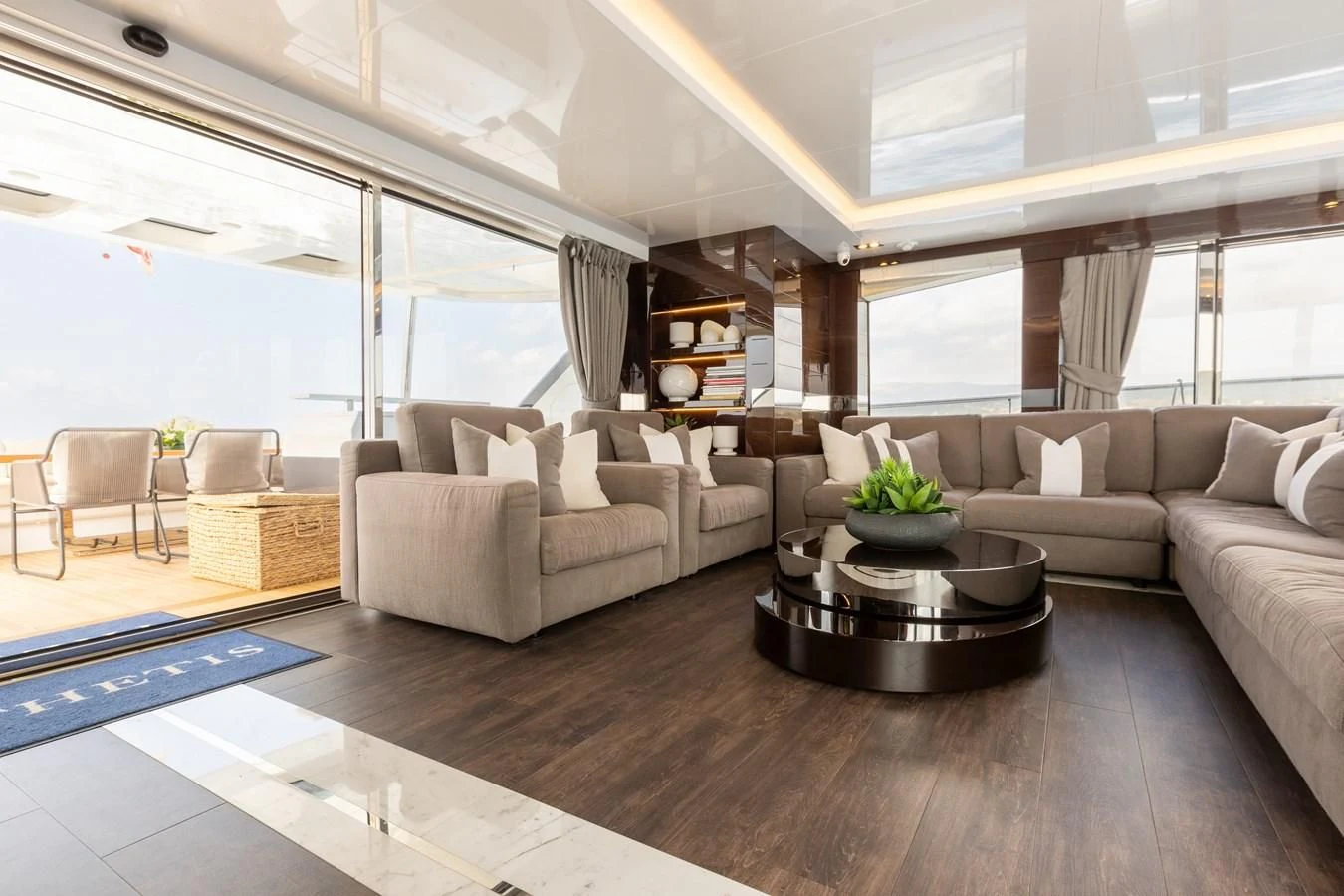a living room with a large window aboard THETIS Yacht for Sale