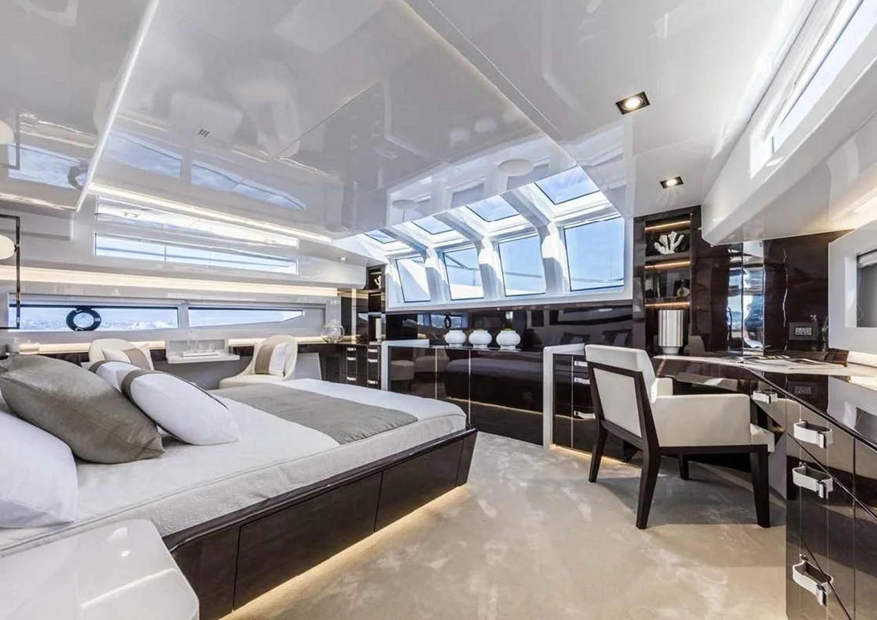 a room with a bed and a desk aboard THETIS Yacht for Sale