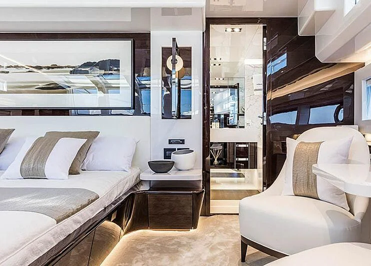 a room with a couch and a mirror aboard THETIS Yacht for Sale