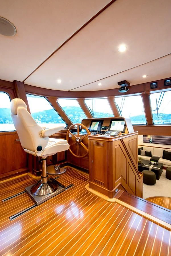 a car with a desk and chairs aboard AVENTURA Yacht for Sale