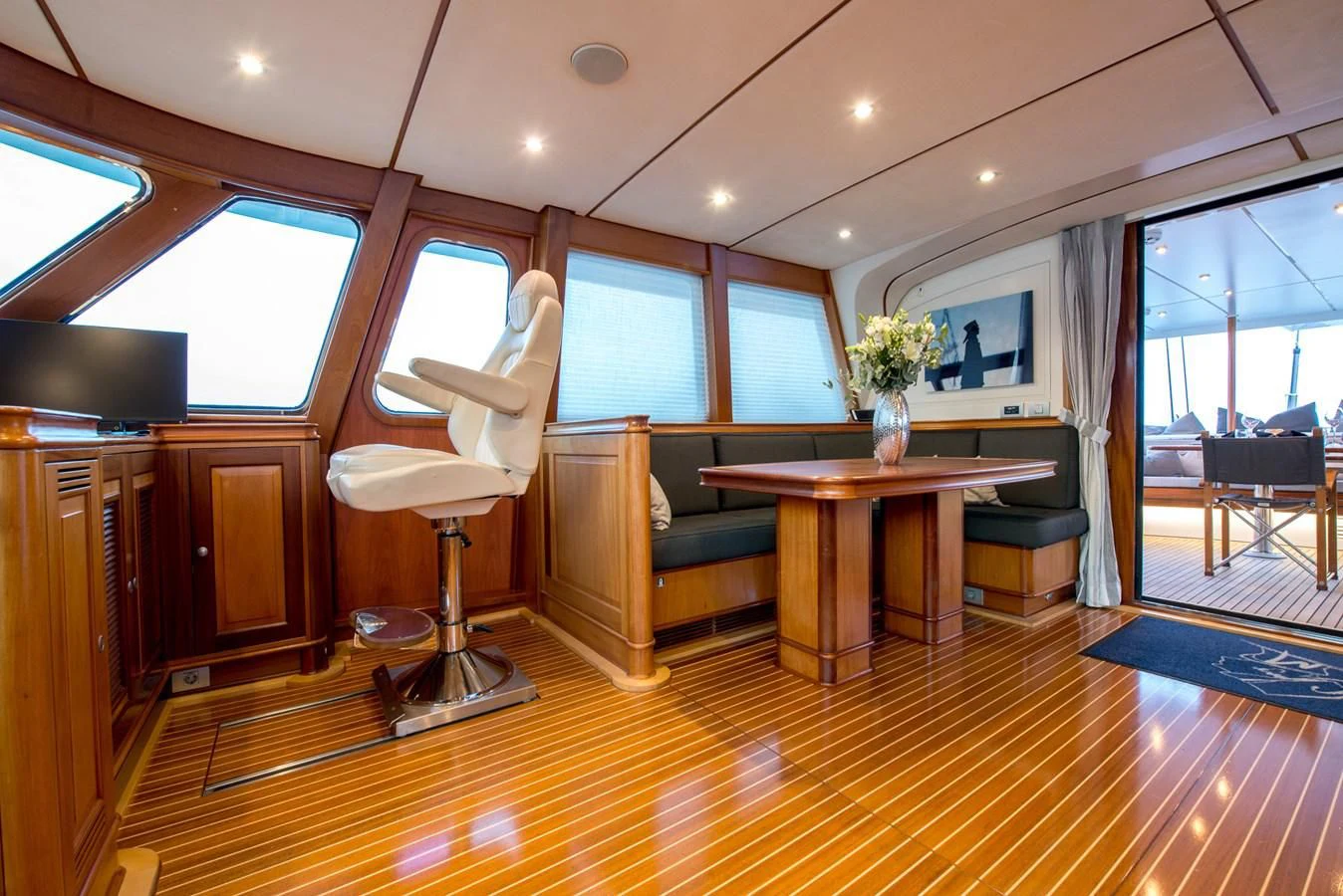 a room with a table and chairs aboard AVENTURA Yacht for Sale