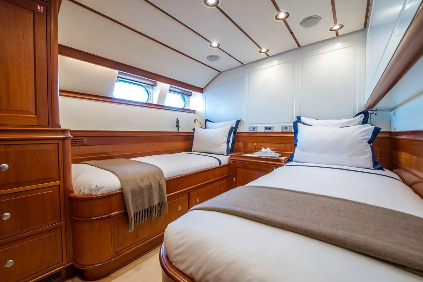 a room with a couple of beds aboard AVENTURA Yacht for Sale