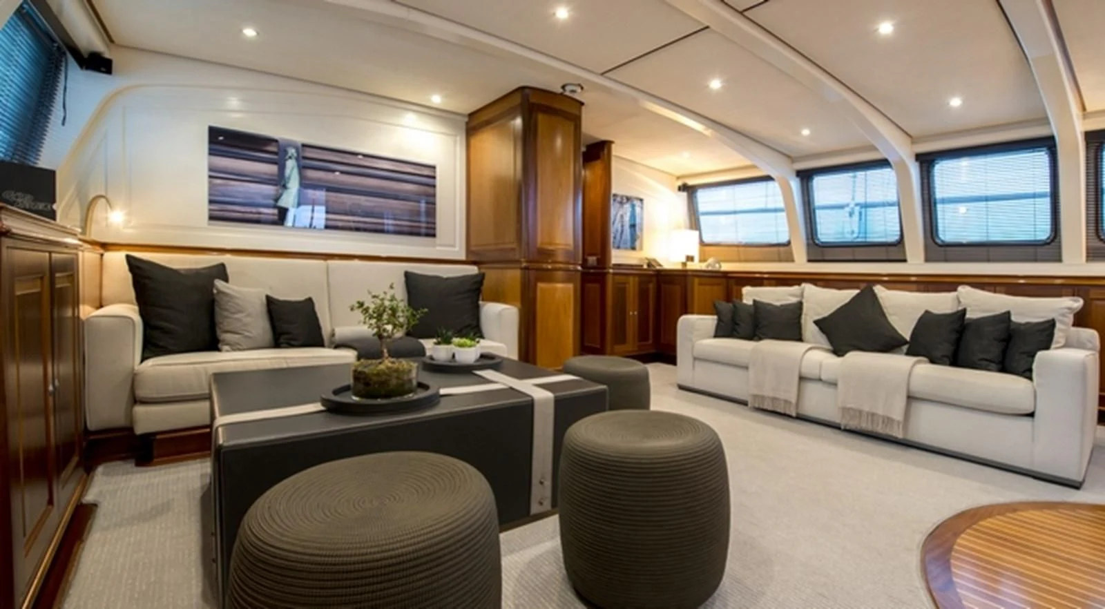 a living room with a couch and a table aboard AVENTURA Yacht for Sale