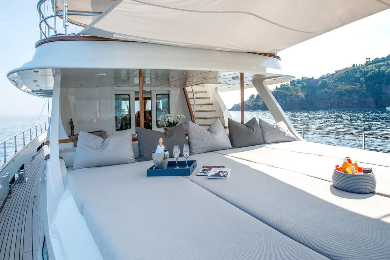 a bed with a white canopy over it aboard AVENTURA Yacht for Sale