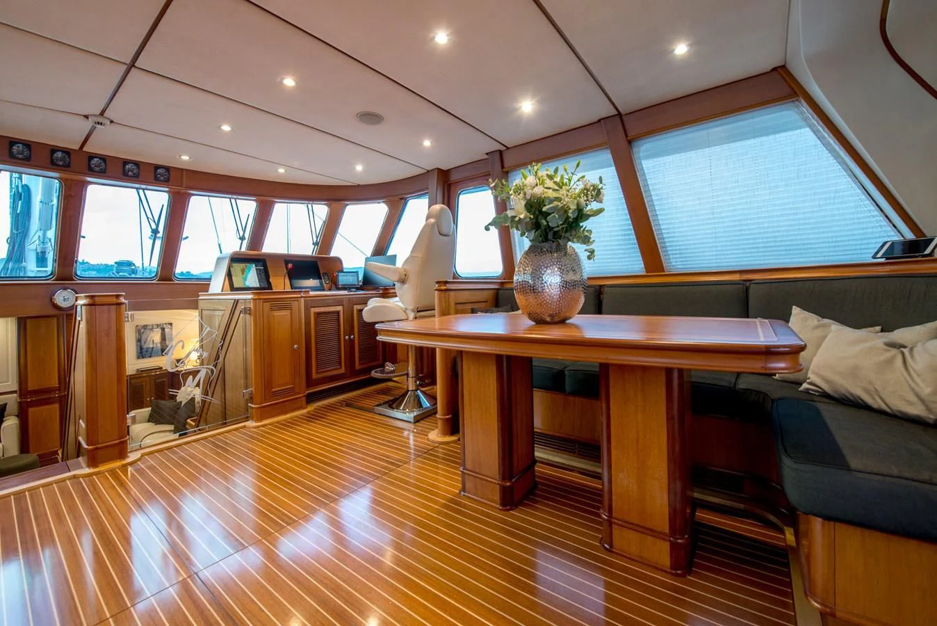 a room with a table and chairs aboard AVENTURA Yacht for Sale