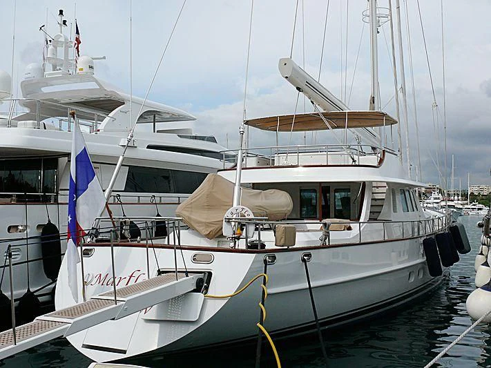 a boat with a flag on the front aboard AVENTURA Yacht for Sale