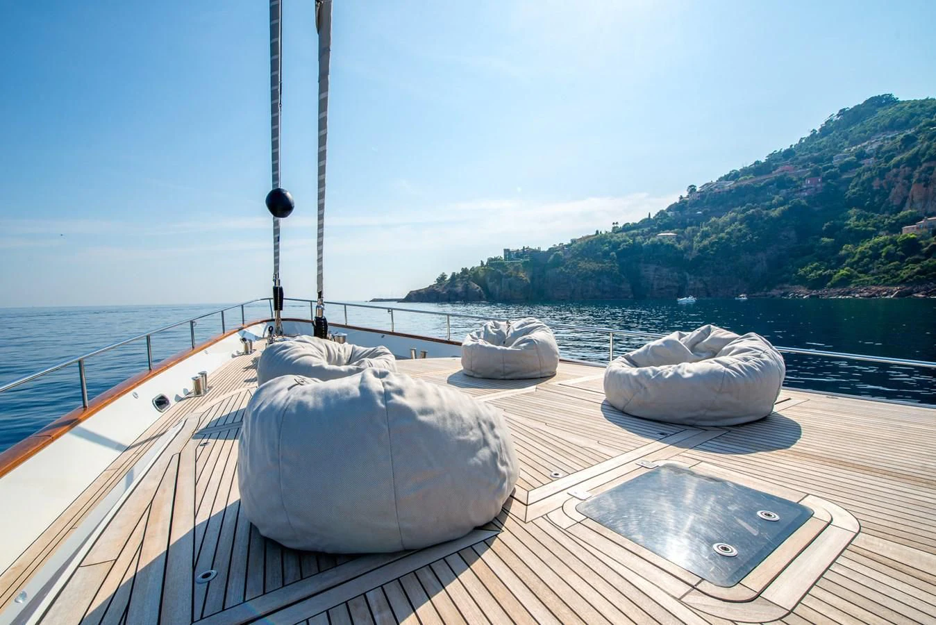 a deck with pillows on it aboard AVENTURA Yacht for Sale