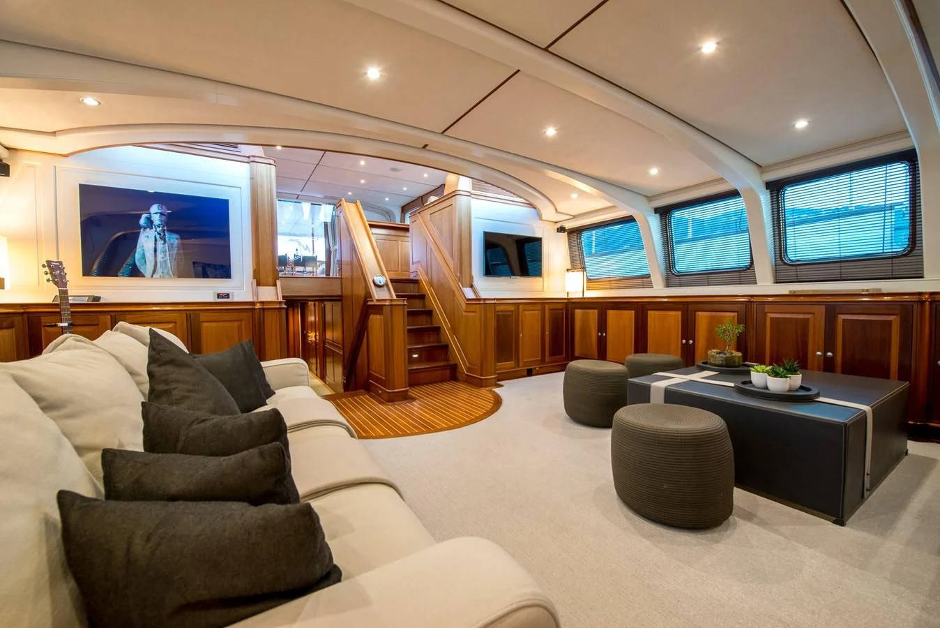 a living room with a large tv aboard AVENTURA Yacht for Sale