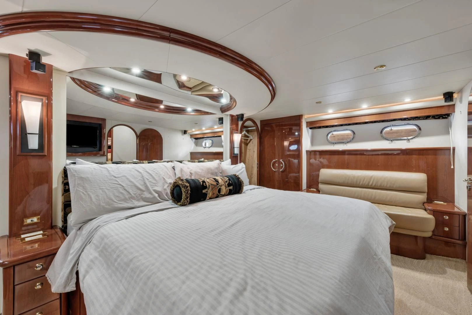 a bedroom with a bed and a dresser aboard CLEW LESS Yacht for Sale