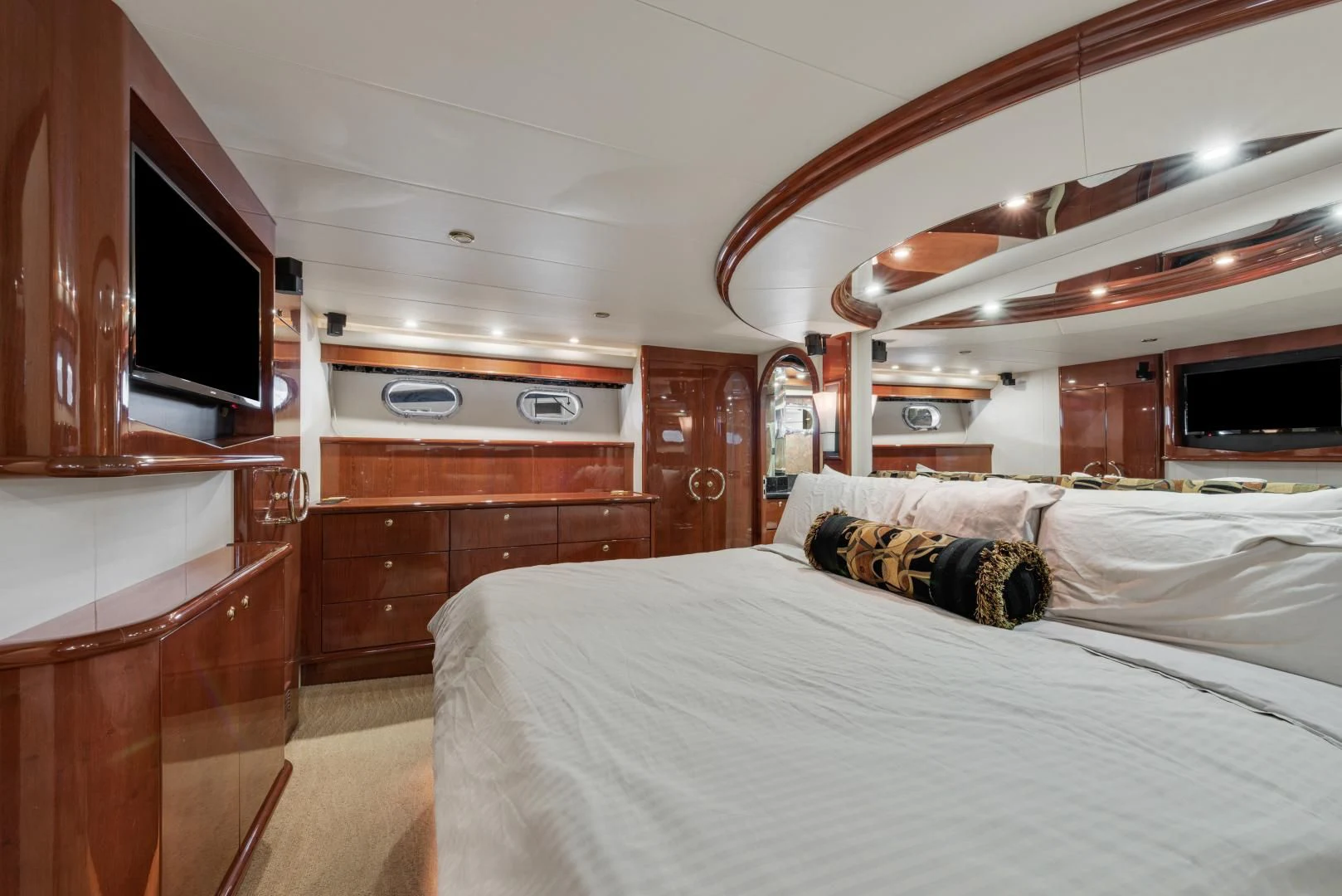 a room with a bed and a television aboard CLEW LESS Yacht for Sale