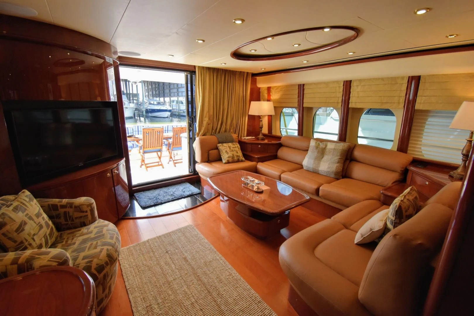 a living room with a large mirror aboard CLEW LESS Yacht for Sale