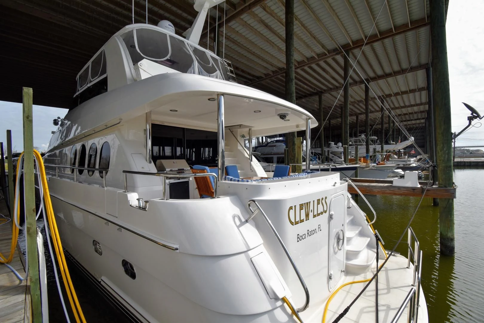 a boat in a harbor aboard CLEW LESS Yacht for Sale