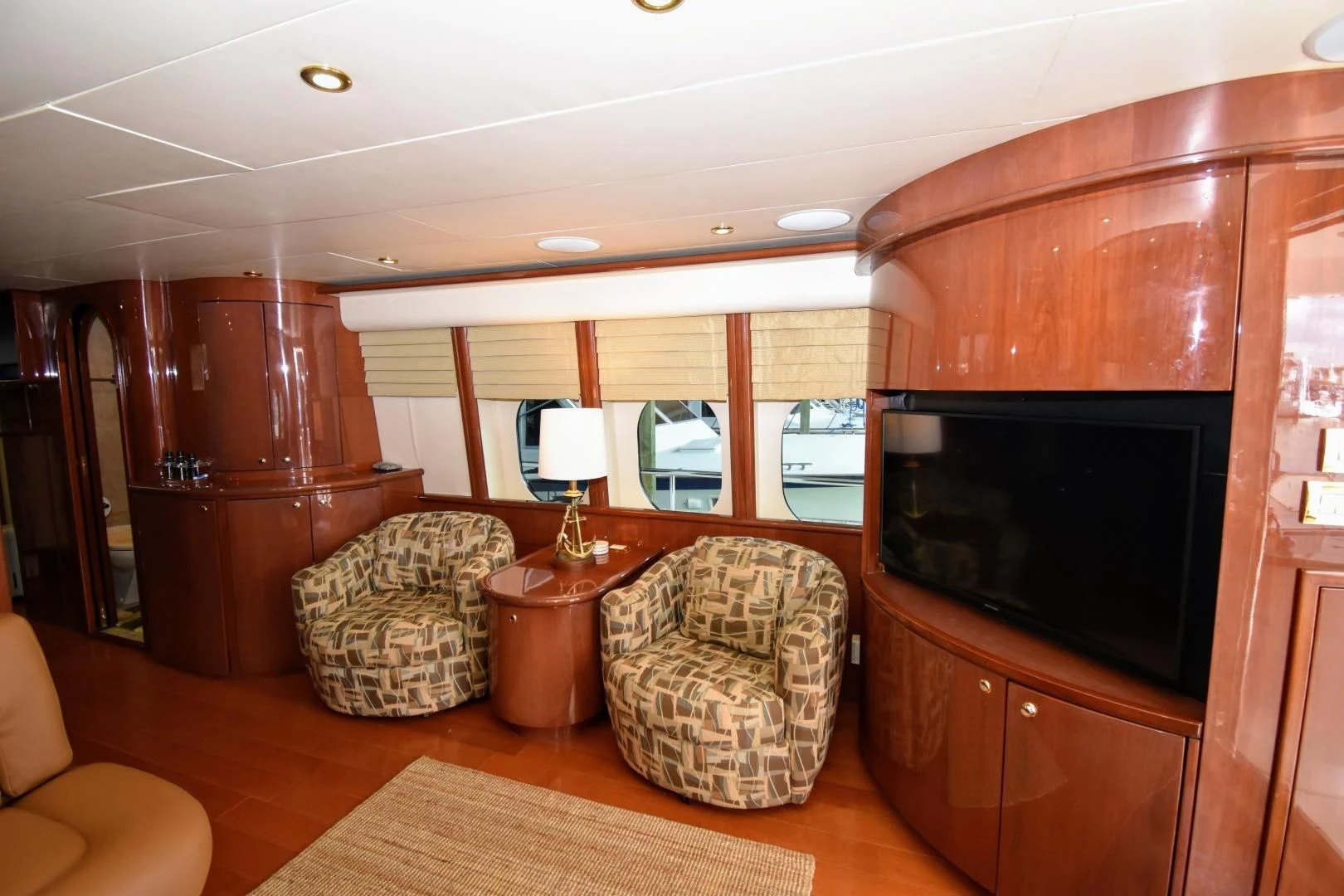 a living room with a fireplace aboard CLEW LESS Yacht for Sale