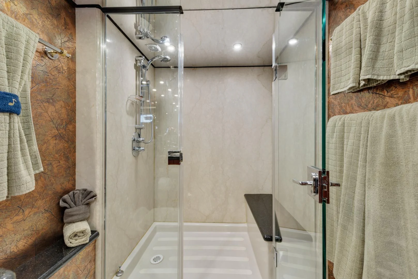 a bathroom with a glass shower aboard CLEW LESS Yacht for Sale