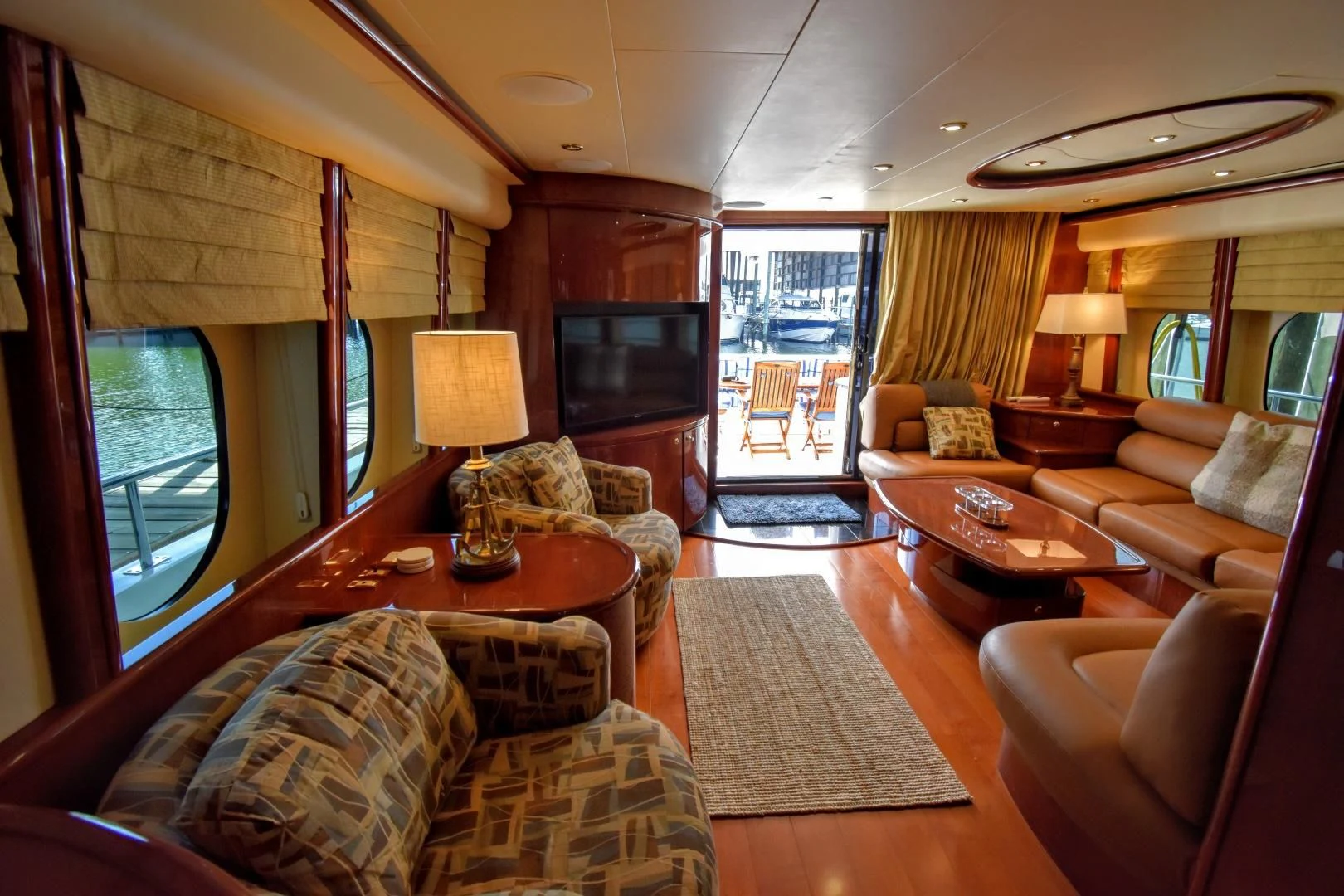 a living room with a large window aboard CLEW LESS Yacht for Sale