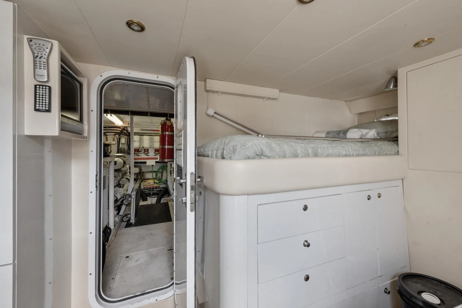 a room with white cabinets and a bed in it aboard CLEW LESS Yacht for Sale