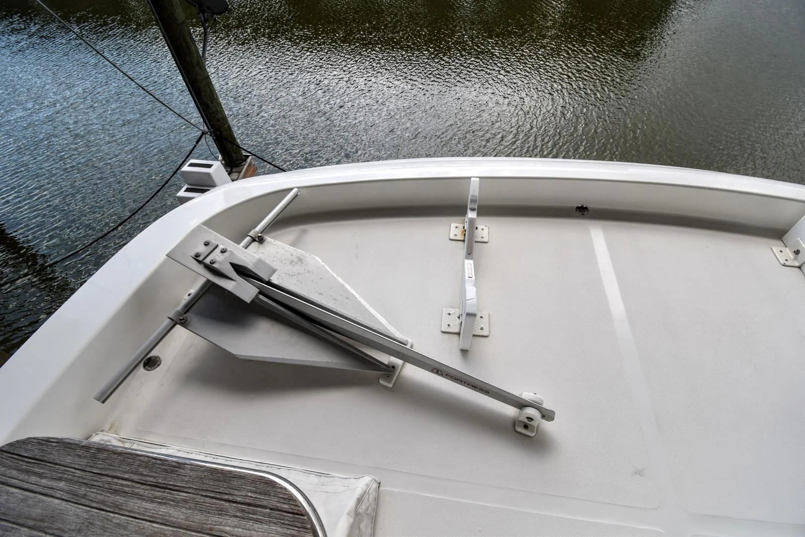 a white boat on a body of water aboard CLEW LESS Yacht for Sale