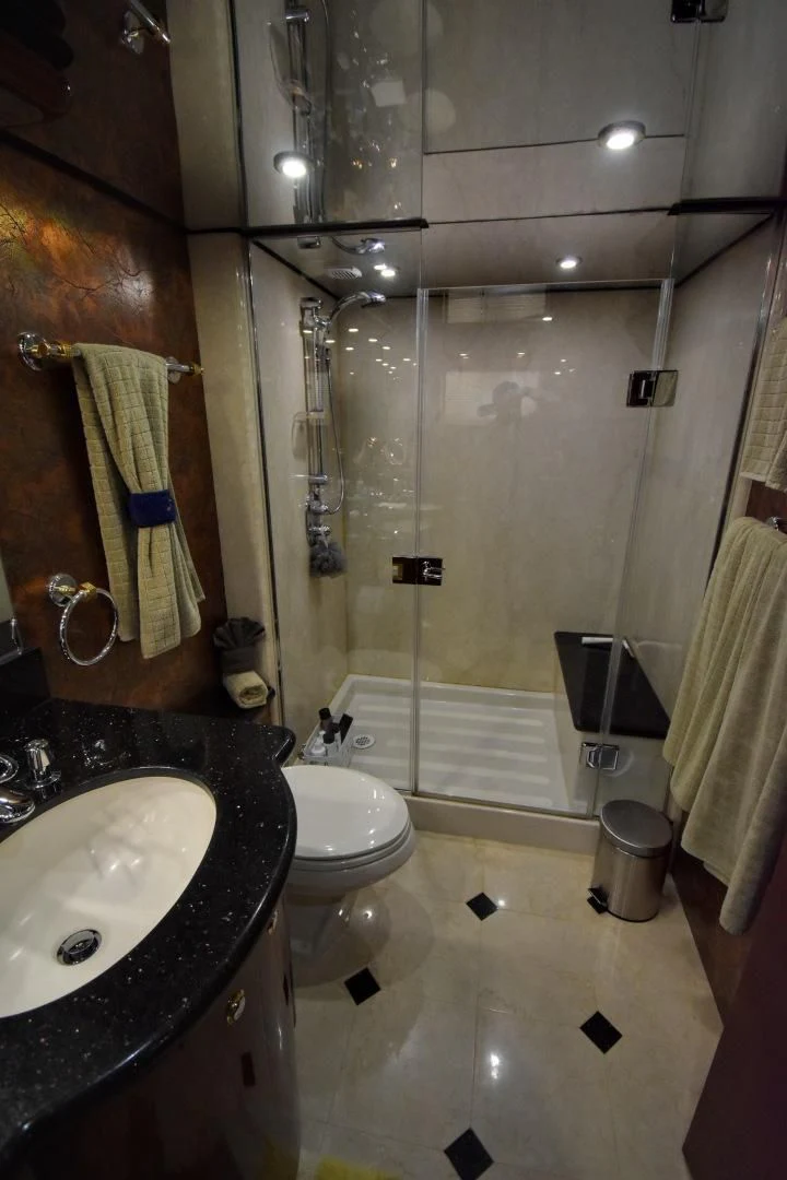 a bathroom with a shower and toilet aboard CLEW LESS Yacht for Sale