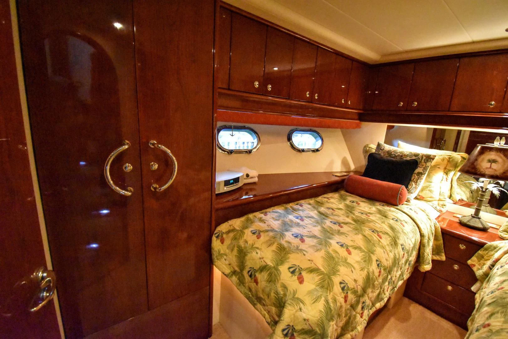 a bedroom with a bed and a closet aboard CLEW LESS Yacht for Sale