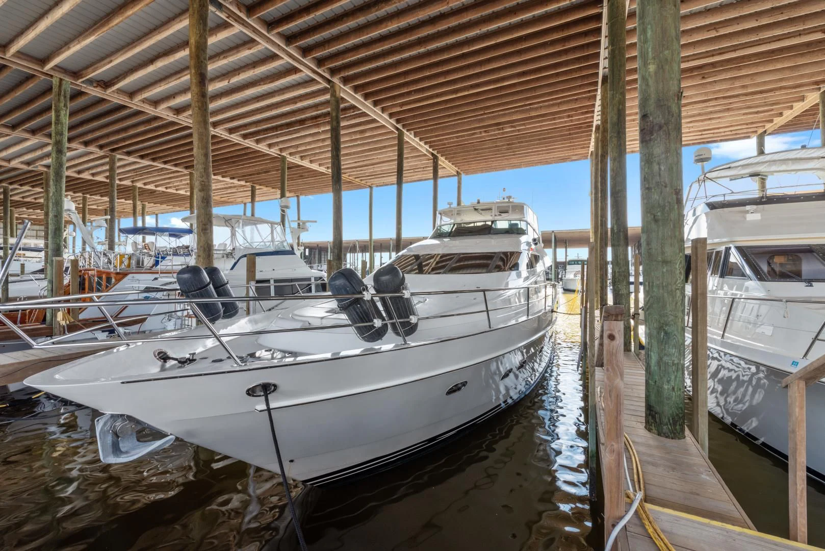 a boat in a harbor aboard CLEW LESS Yacht for Sale