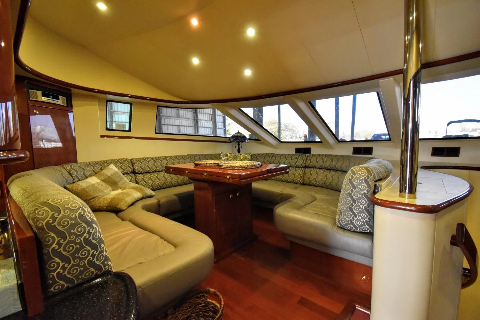a living room with a couch and a coffee table aboard CLEW LESS Yacht for Sale