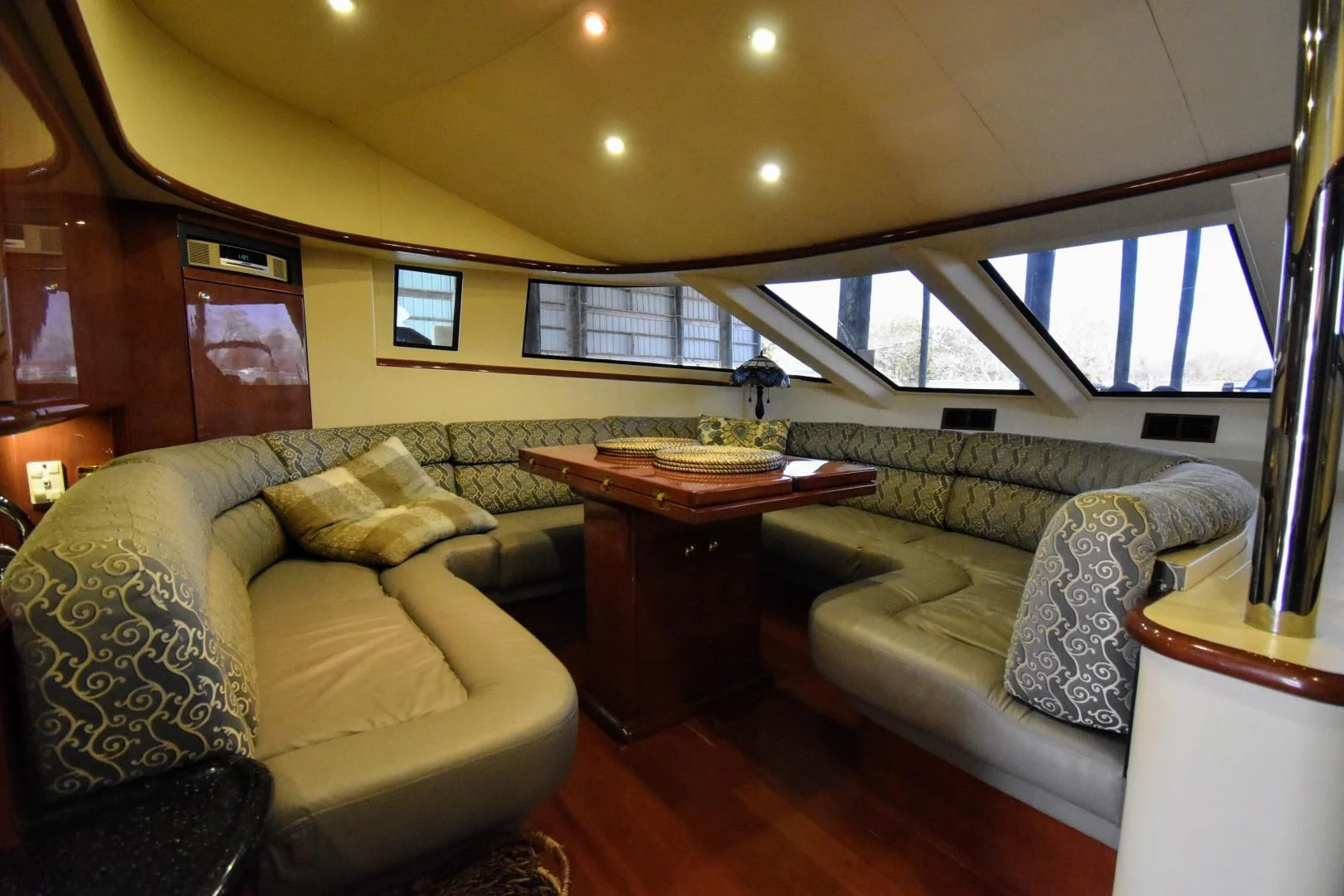 a living room with a couch and a table aboard CLEW LESS Yacht for Sale