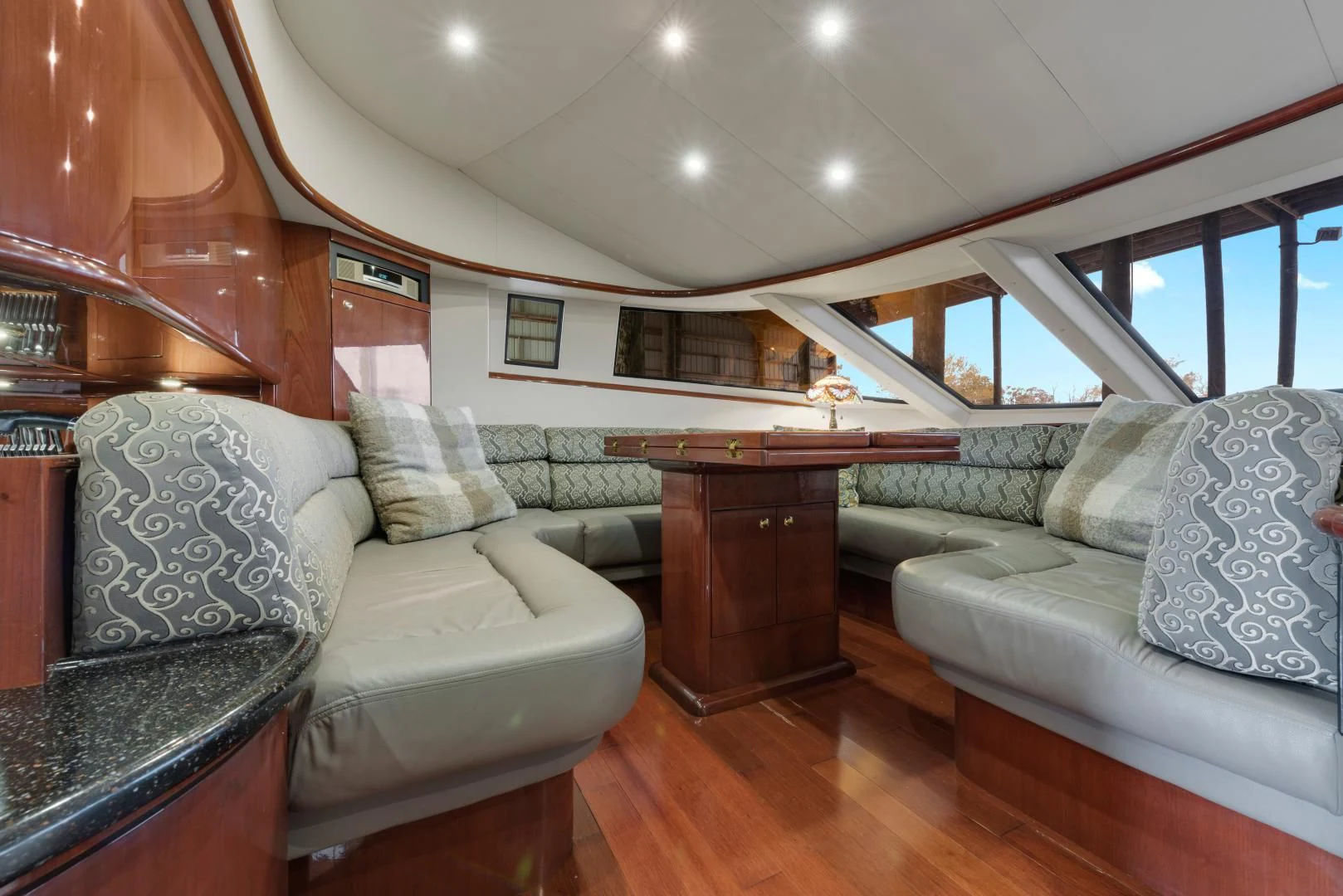 a living room with a couch and a table aboard CLEW LESS Yacht for Sale