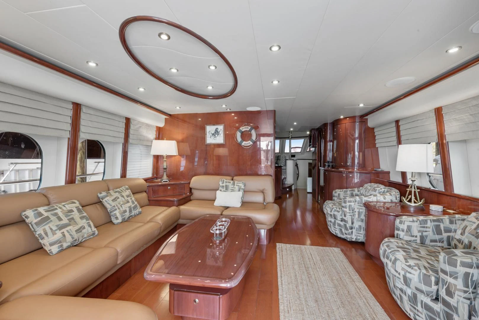 a living room with a large mirror aboard CLEW LESS Yacht for Sale