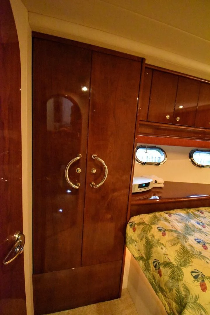 a wooden door with a mirror above it aboard CLEW LESS Yacht for Sale