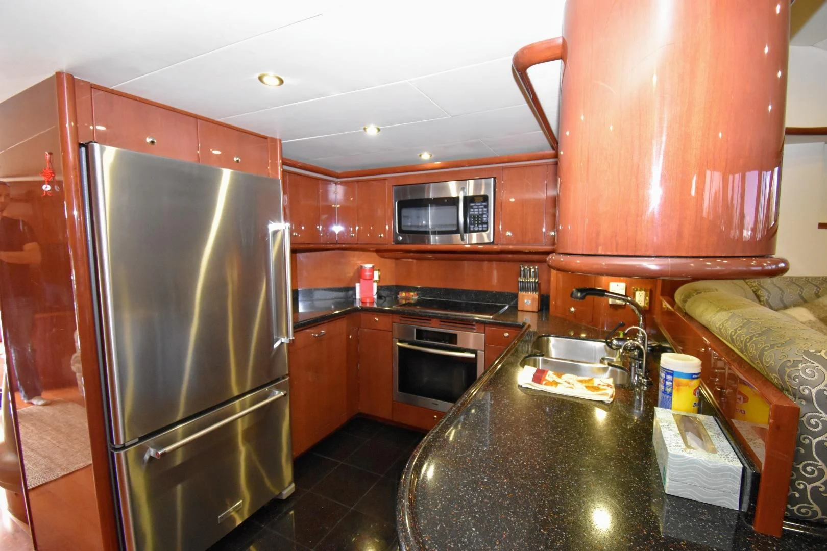 a kitchen with a stainless steel refrigerator aboard CLEW LESS Yacht for Sale