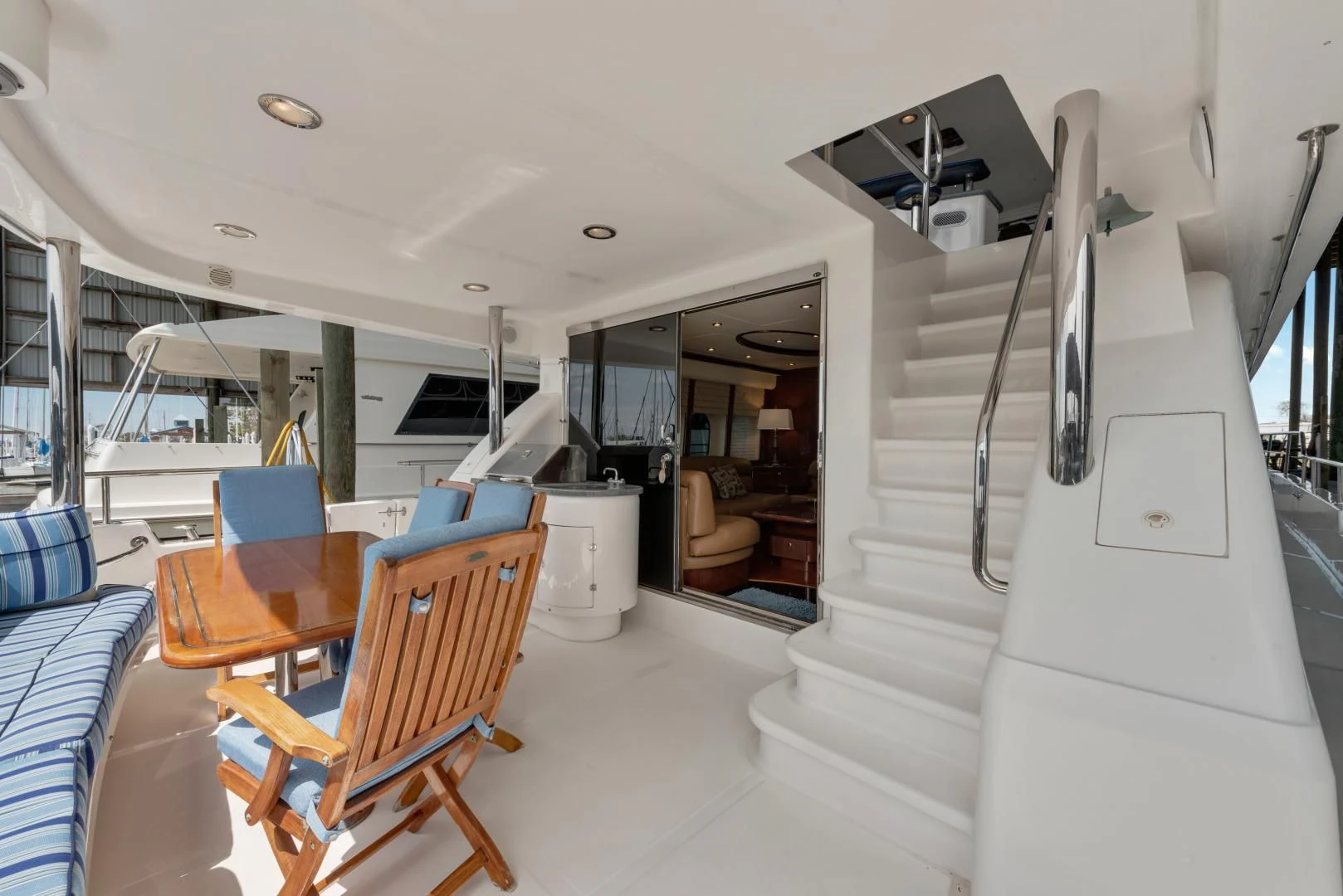 a room with a table and chairs aboard CLEW LESS Yacht for Sale