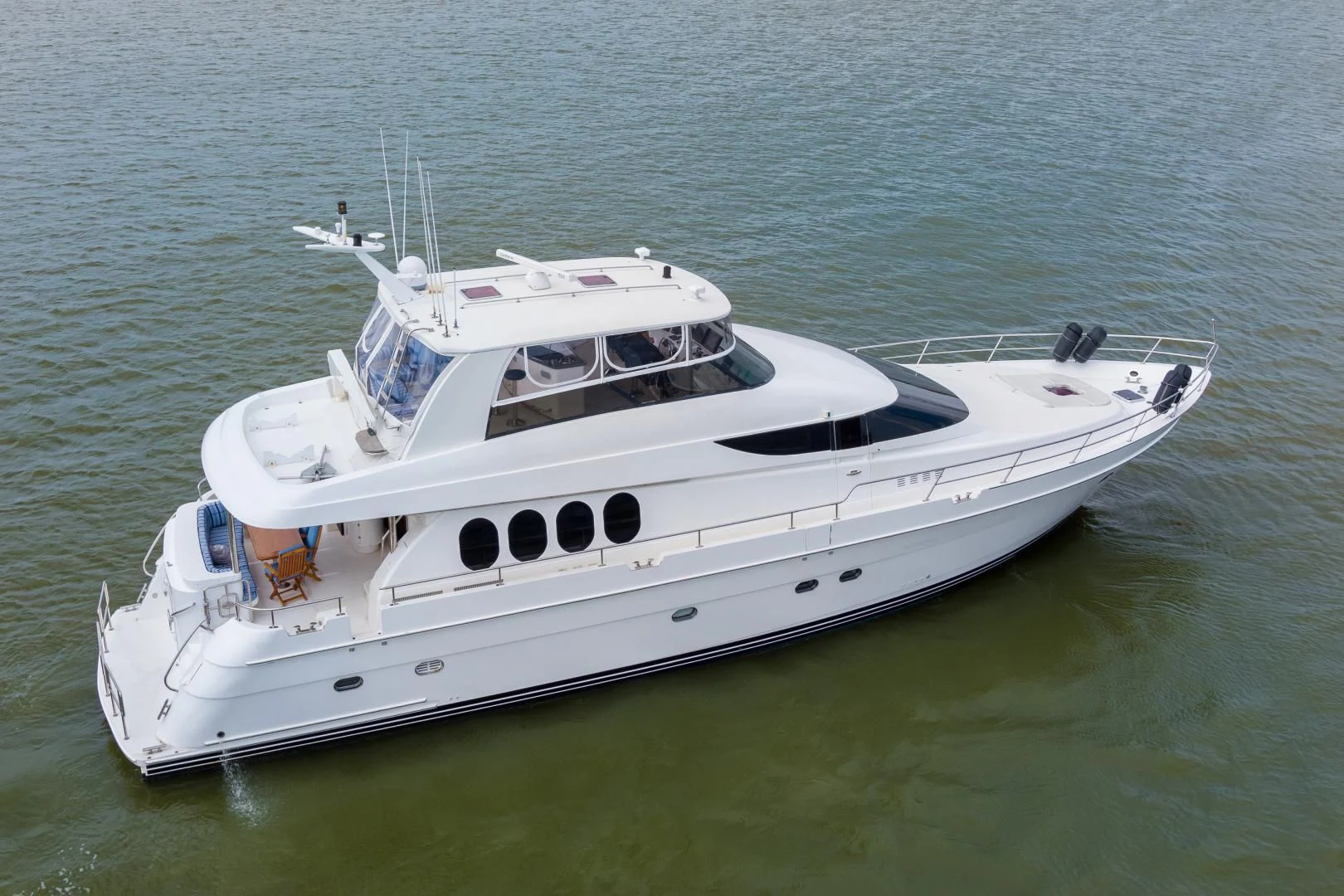 a white boat on the water aboard CLEW LESS Yacht for Sale