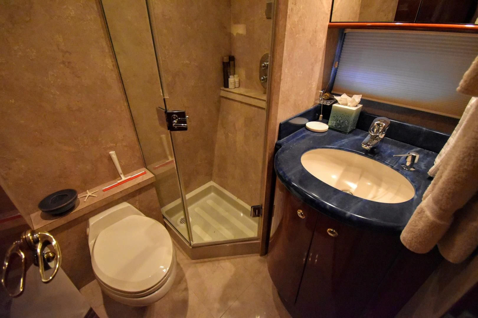 a bathroom with a sink and a toilet aboard CLEW LESS Yacht for Sale