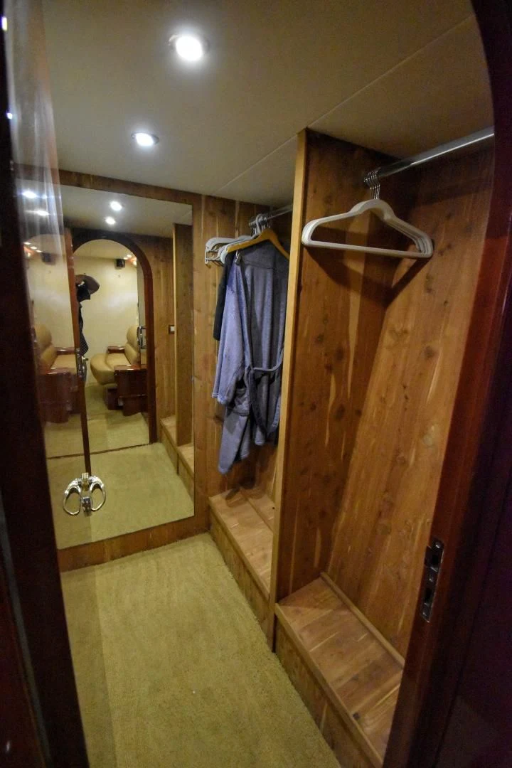 a bathroom with a mirror and a door aboard CLEW LESS Yacht for Sale