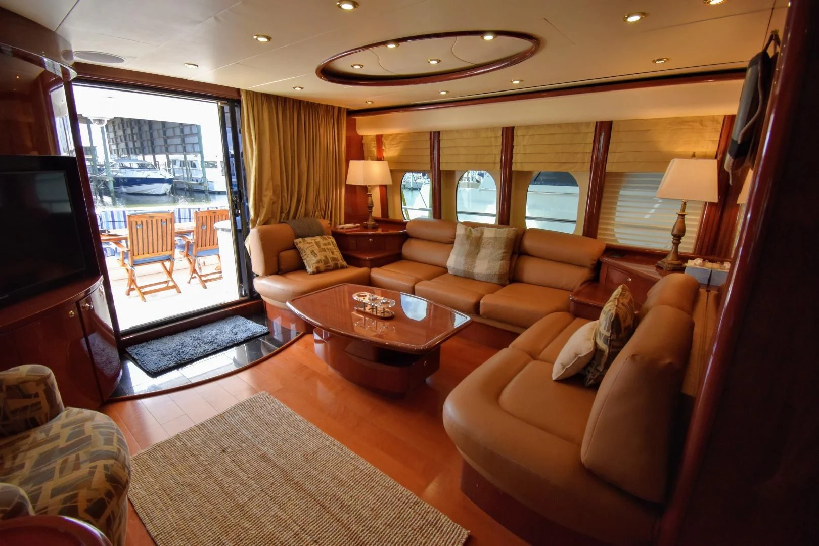 a living room with a large glass door aboard CLEW LESS Yacht for Sale