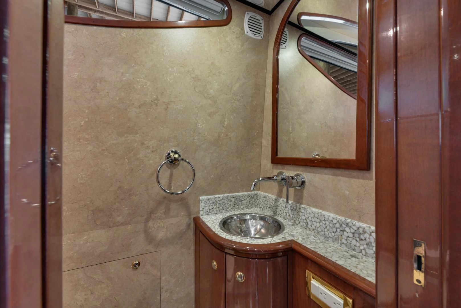 a bathroom with a sink and a mirror aboard CLEW LESS Yacht for Sale