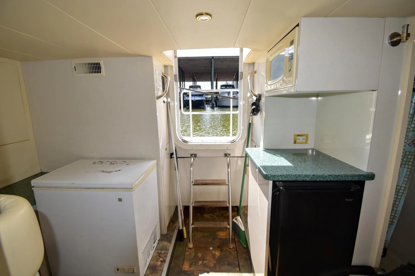 a small room with a sink and a window aboard CLEW LESS Yacht for Sale