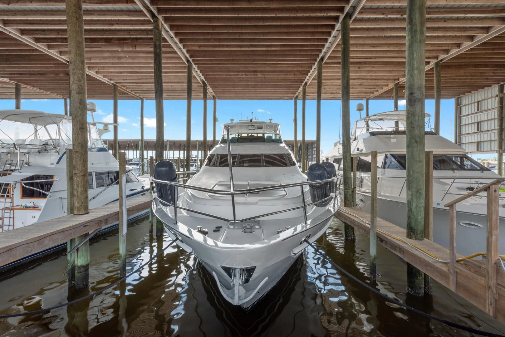 a group of boats are parked under a covered bridge aboard CLEW LESS Yacht for Sale