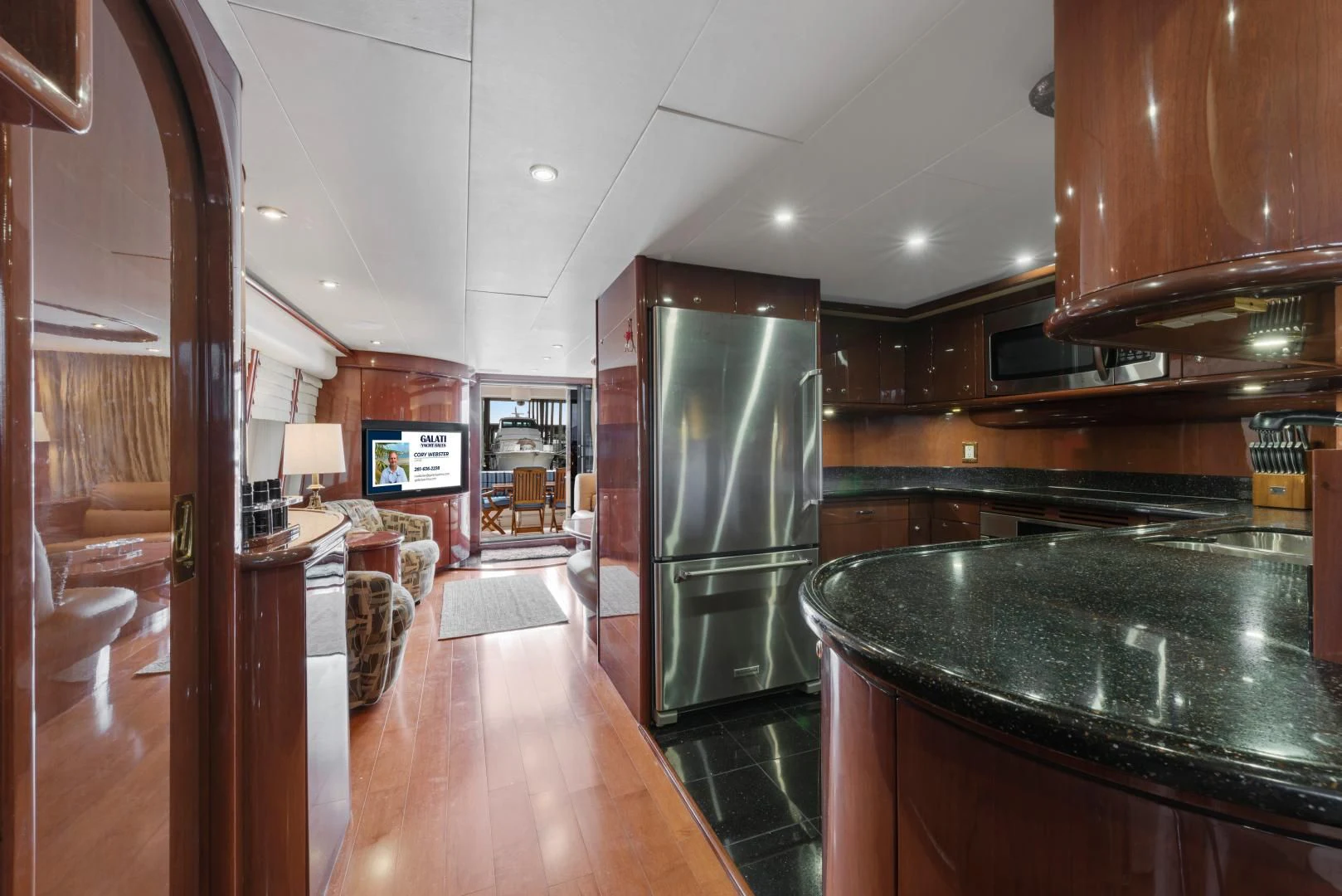 a kitchen with a large island aboard CLEW LESS Yacht for Sale