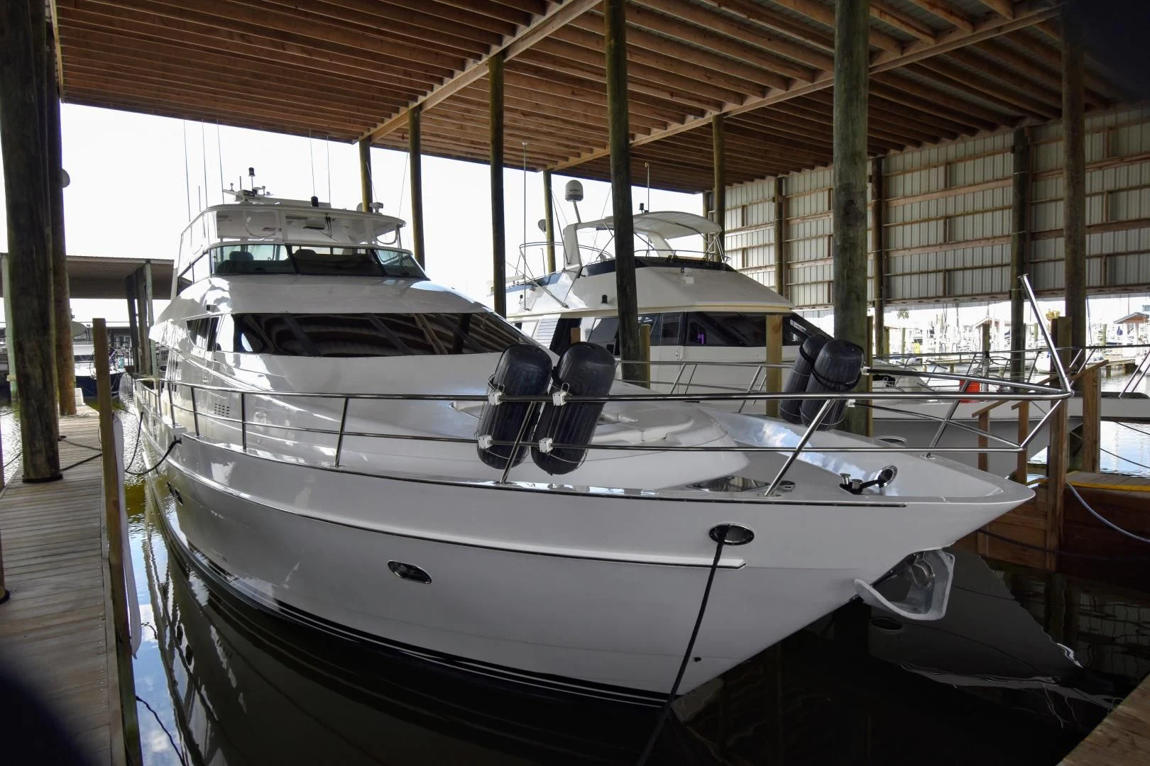 a couple of boats in a large warehouse aboard CLEW LESS Yacht for Sale