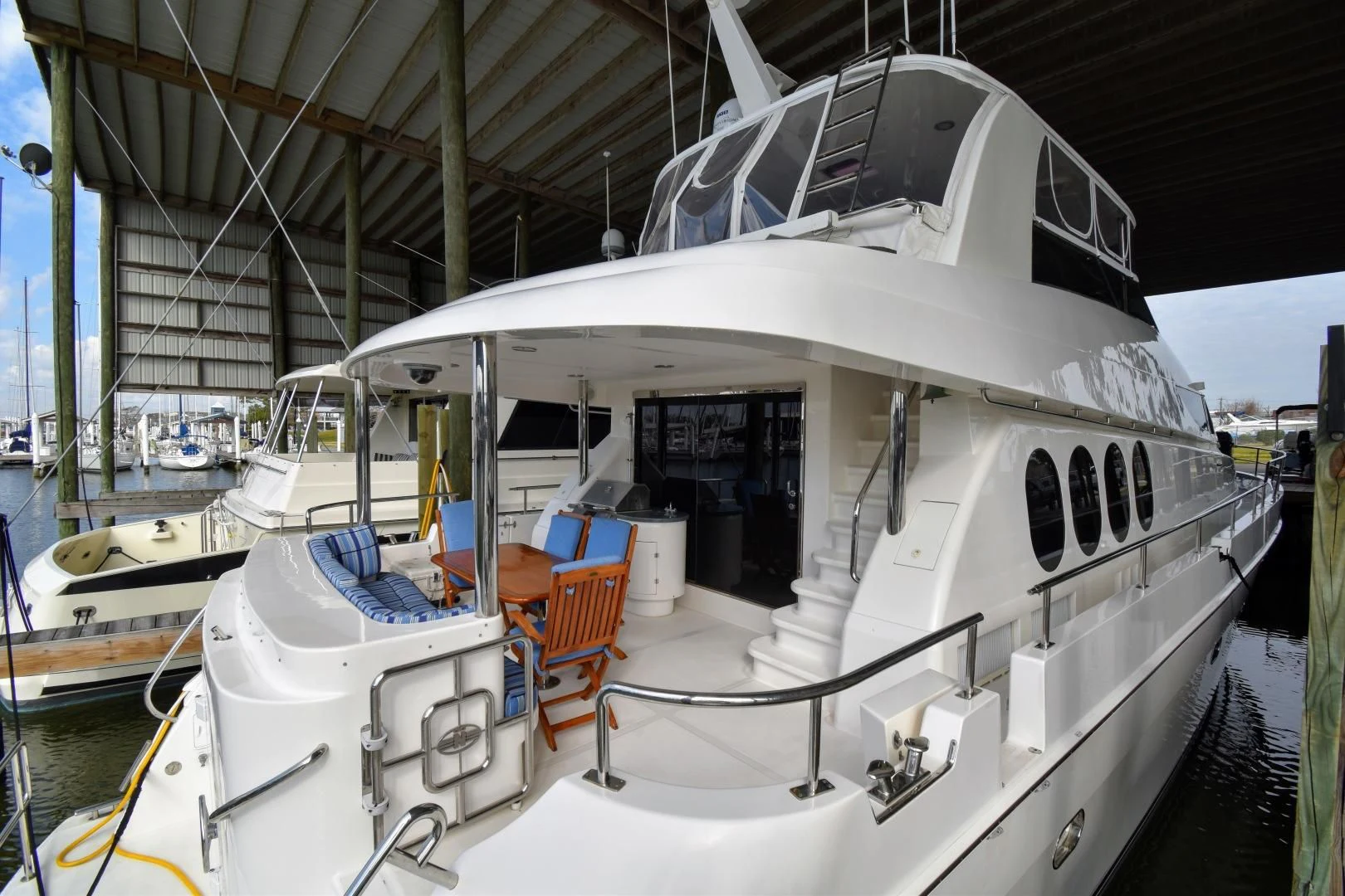 a boat docked in a harbor aboard CLEW LESS Yacht for Sale