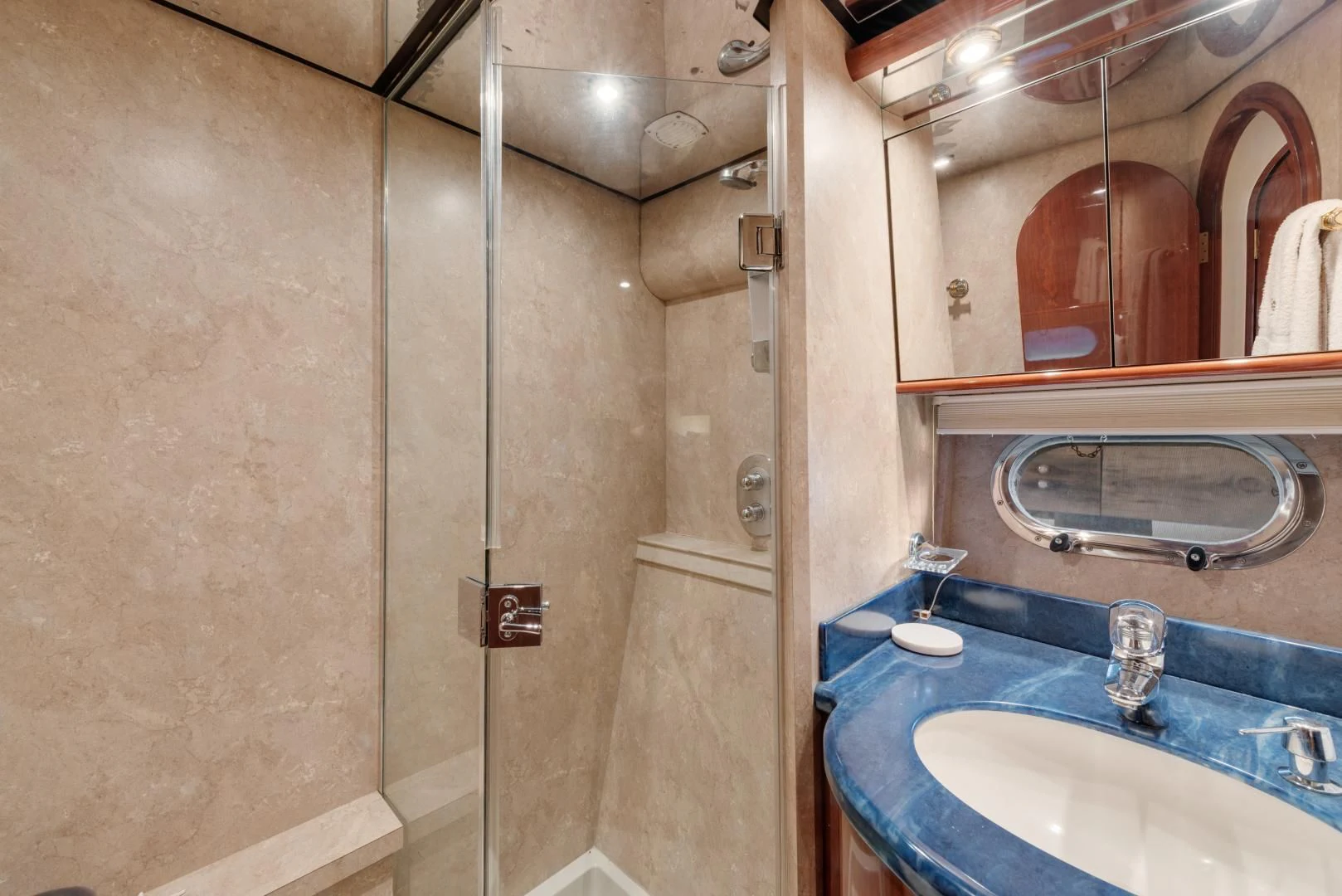 a bathroom with a sink and a mirror aboard CLEW LESS Yacht for Sale