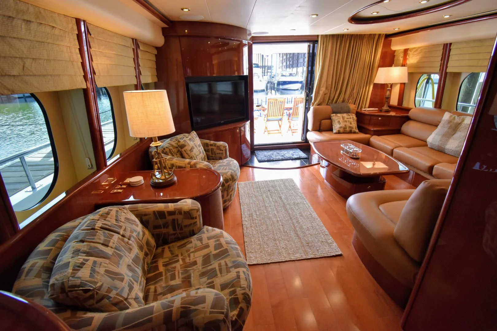 a living room with a large window aboard CLEW LESS Yacht for Sale
